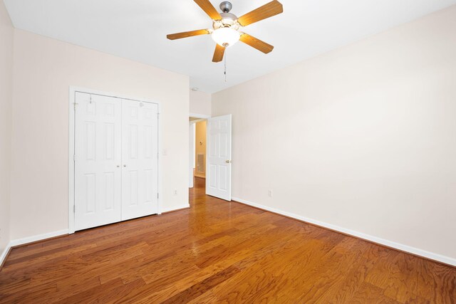 6239 Jacq Ct Unit 57, Hixson, TN 37343 - unfurnished bedroom featuring wood finished floors, a closet, and ceiling fan