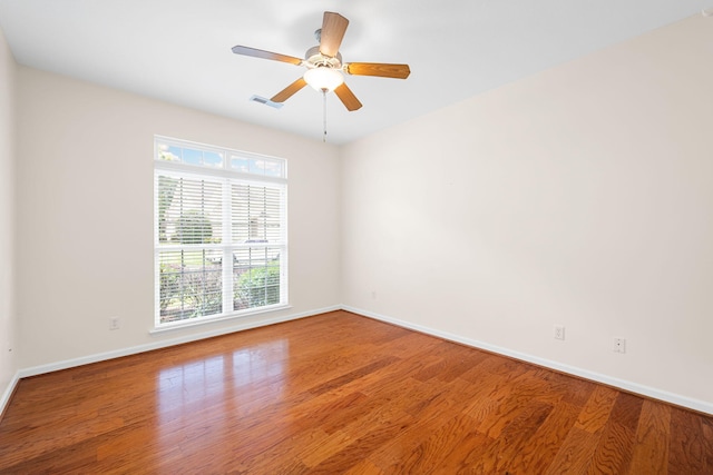 6239 Jacq Ct Unit 57, Hixson, TN 37343 - empty room with plenty of natural light, wood finished floors, and a ceiling fan