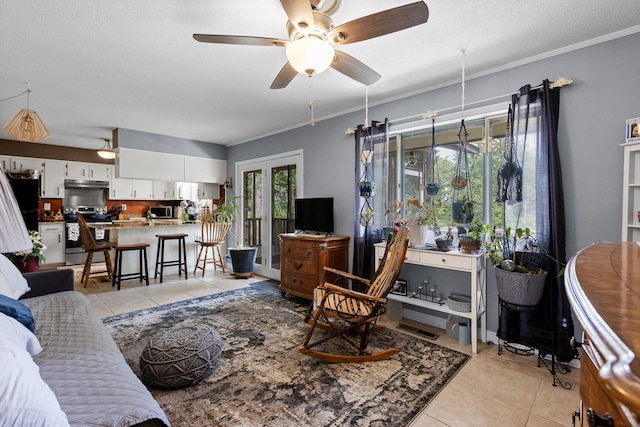 1008 Panorama Dr, Chattanooga, TN 37421 - living area with light tile patterned floors, a ceiling fan, and crown molding