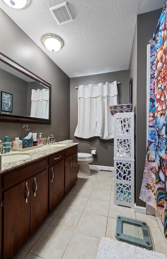 1008 Panorama Dr, Chattanooga, TN 37421 - bathroom featuring vanity, tile patterned flooring, a textured ceiling, and curtained shower