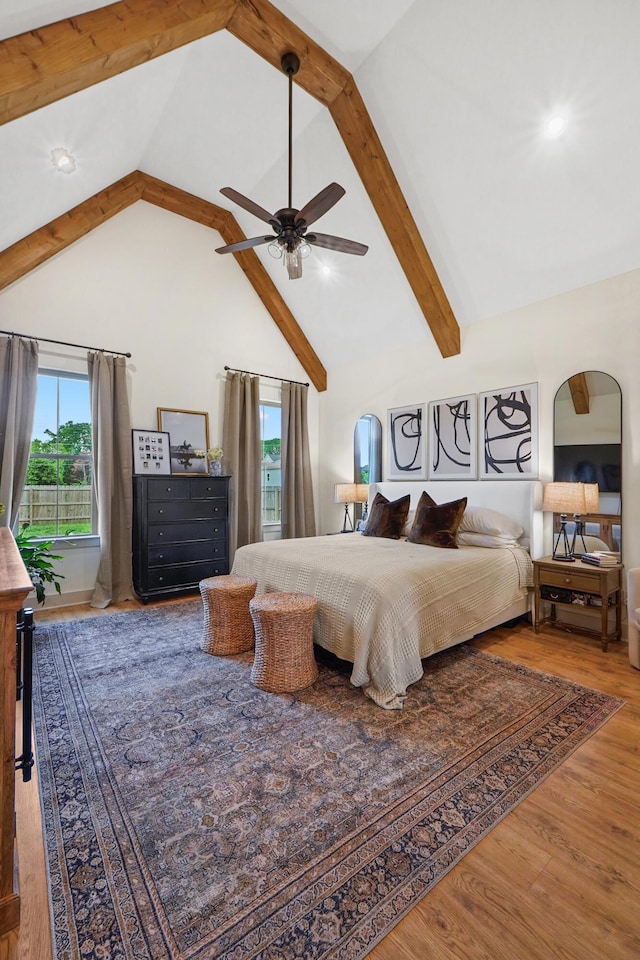 6822 Bacon Ln Unit B, Chattanooga, TN 37421 - bedroom featuring arched walkways, beam ceiling, wood finished floors, high vaulted ceiling, and a ceiling fan