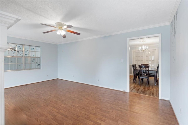 5146 Creek Bend Cir NW, Cleveland, TN 37312 - empty room with ceiling fan, wood finished floors, a chandelier, and ornamental molding