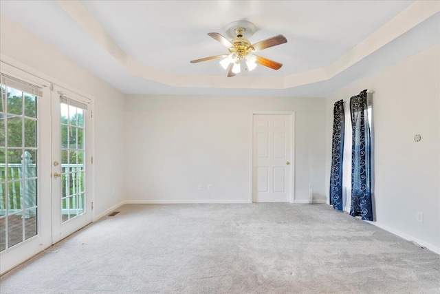 5146 Creek Bend Cir NW, Cleveland, TN 37312 - empty room featuring carpet, a raised ceiling, and a ceiling fan