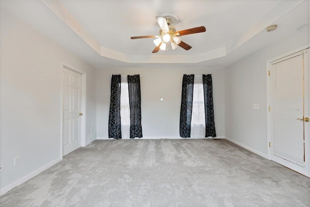 5146 Creek Bend Cir NW, Cleveland, TN 37312 - carpeted spare room with a tray ceiling, a ceiling fan, and a smoke detector