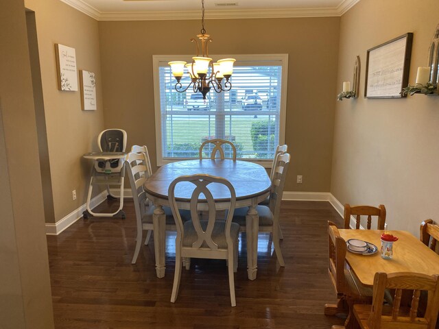 151 Holly Oak Ln, Ringgold, GA 30736 - dining area featuring crown molding, dark wood-type flooring, and a chandelier