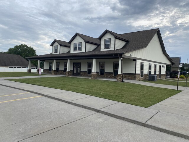 151 Holly Oak Ln, Ringgold, GA 30736 - view of front of property with stone siding, a porch, a front lawn, and a shingled roof