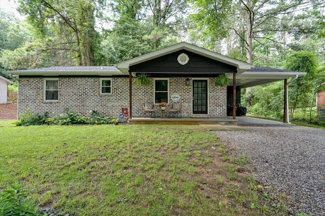 308 Pledger Pkwy, Lafayette, GA 30728 - ranch-style home with driveway, an attached carport, a front yard, brick siding, and covered porch