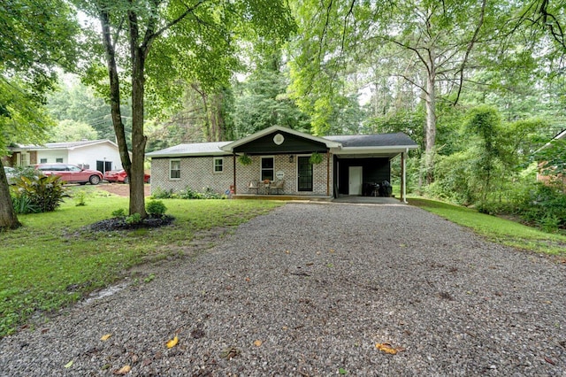 308 Pledger Pkwy, Lafayette, GA 30728 - ranch-style home featuring driveway, a carport, a front lawn, and brick siding
