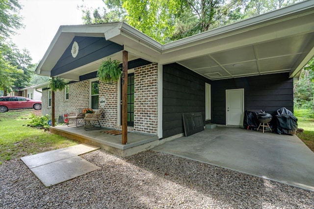 308 Pledger Pkwy, Lafayette, GA 30728 - view of side of property with brick siding, a carport, and driveway