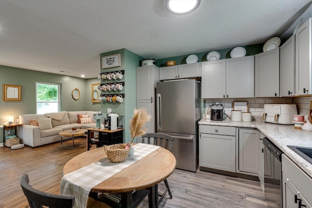 308 Pledger Pkwy, Lafayette, GA 30728 - dining area featuring a textured ceiling and light wood-style flooring