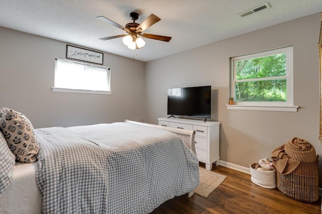 308 Pledger Pkwy, Lafayette, GA 30728 - bedroom with wood finished floors, multiple windows, ceiling fan, and a textured ceiling
