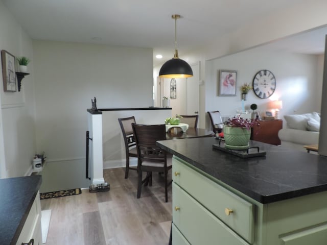 87 Lawrence Dr, Ringgold, GA 30736 - kitchen with green cabinets, light wood-type flooring, and dark countertops