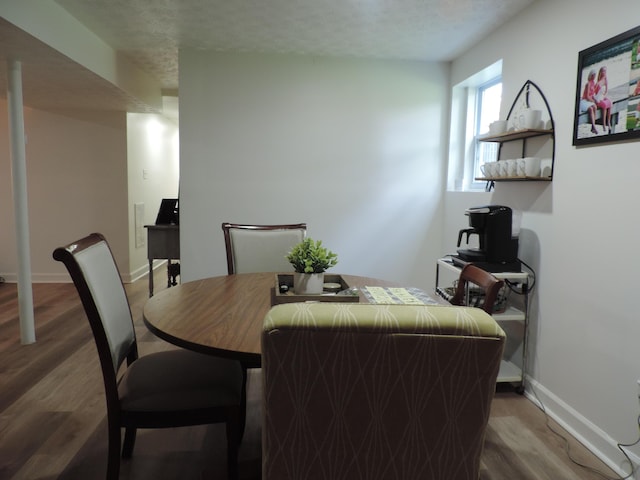 87 Lawrence Dr, Ringgold, GA 30736 - dining area with wood finished floors and a textured ceiling