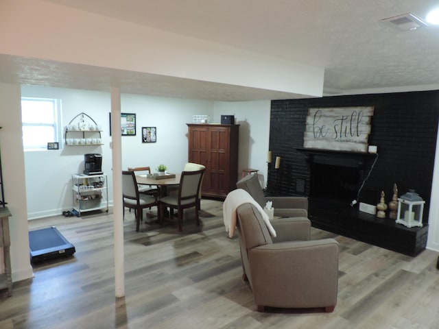87 Lawrence Dr, Ringgold, GA 30736 - living area with a brick fireplace and wood finished floors