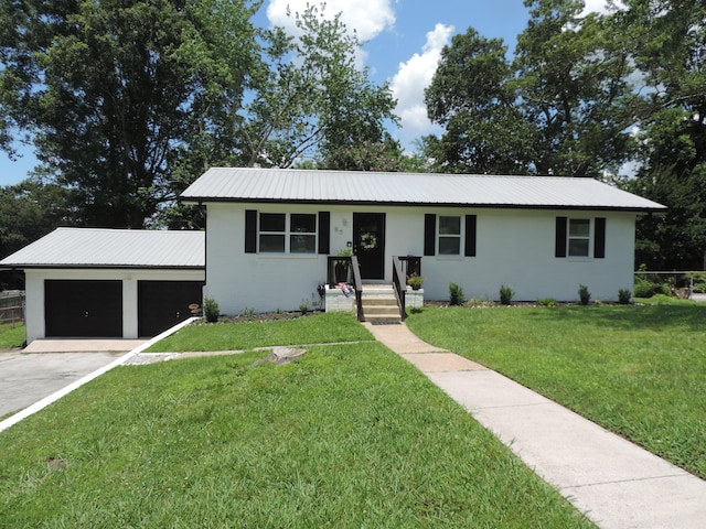 87 Lawrence Dr, Ringgold, GA 30736 - single story home with a metal roof, an attached garage, a front lawn, and driveway