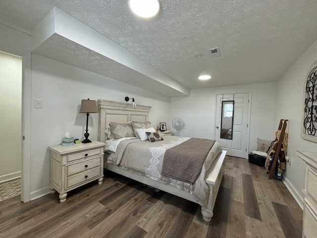 87 Lawrence Dr, Ringgold, GA 30736 - bedroom with dark wood-style floors and a textured ceiling
