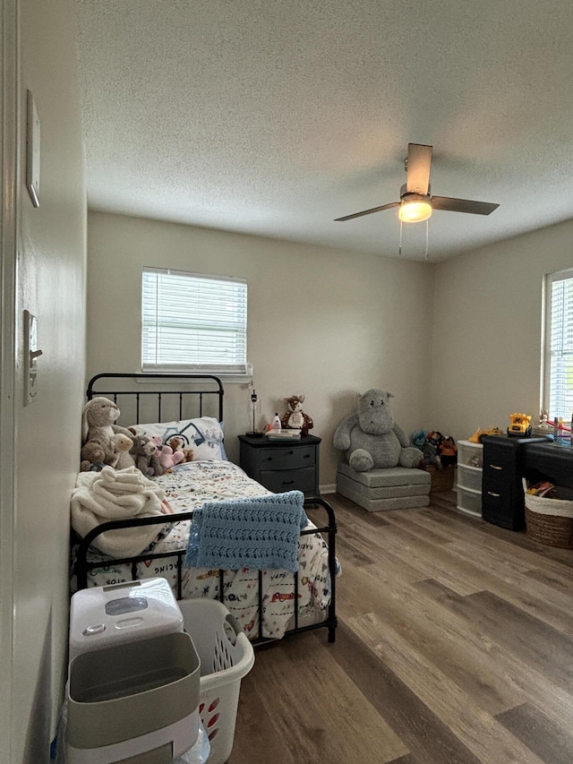 87 Lawrence Dr, Ringgold, GA 30736 - bedroom featuring wood finished floors, a textured ceiling, and ceiling fan