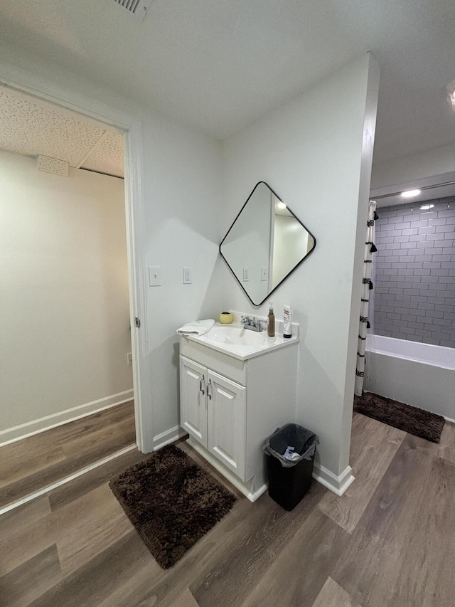 87 Lawrence Dr, Ringgold, GA 30736 - bathroom with vanity, wood finished floors, and shower / bath combo with shower curtain