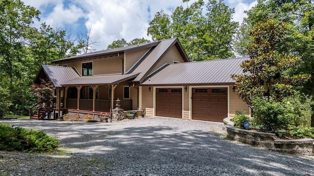 80 Tanya Ln, Dunlap, TN 37327 - view of front of property with a garage, covered porch, gravel driveway, and a metal roof
