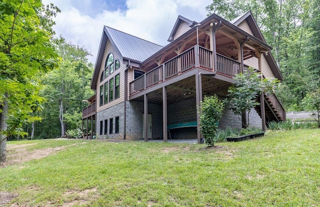 80 Tanya Ln, Dunlap, TN 37327 - back of property with a wooden deck, a lawn, and a metal roof