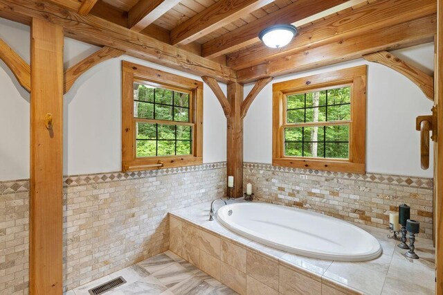 80 Tanya Ln, Dunlap, TN 37327 - bathroom with a wooden ceiling with exposed beams, a garden tub, healthy amount of natural light, wainscoting, and tile walls
