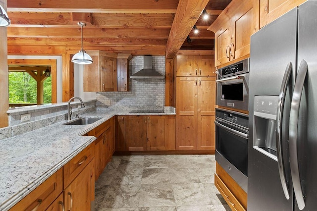 80 Tanya Ln, Dunlap, TN 37327 - kitchen featuring stainless steel appliances, wall chimney exhaust hood, brown cabinetry, decorative backsplash, and beamed ceiling