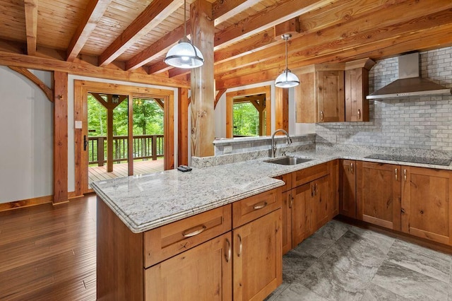80 Tanya Ln, Dunlap, TN 37327 - kitchen featuring wall chimney exhaust hood, backsplash, brown cabinetry, hanging light fixtures, and a wooden ceiling with exposed beams