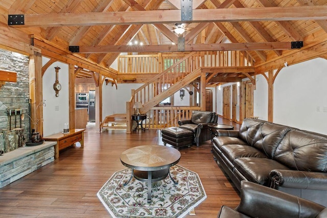 80 Tanya Ln, Dunlap, TN 37327 - living area featuring stairway, a wood ceiling with exposed beams, wood-type flooring, high vaulted ceiling, and a fireplace