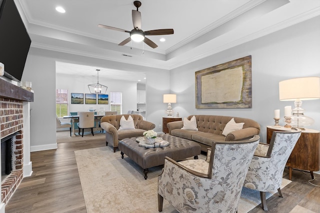 3339 Stone Creek Dr, Chattanooga, TN 37405 - living area featuring wood finished floors, crown molding, a ceiling fan, a fireplace, and recessed lighting
