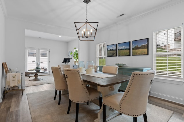 3339 Stone Creek Dr, Chattanooga, TN 37405 - dining space featuring a chandelier, wood finished floors, and crown molding