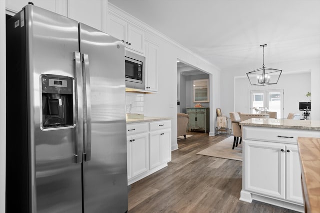 3339 Stone Creek Dr, Chattanooga, TN 37405 - kitchen featuring stainless steel appliances, a chandelier, dark wood-style floors, white cabinetry, and decorative light fixtures