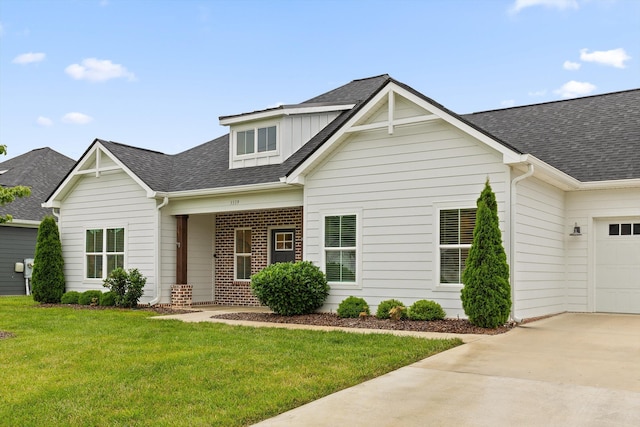 3339 Stone Creek Dr, Chattanooga, TN 37405 - view of front facade featuring roof with shingles, driveway, a garage, and a front lawn
