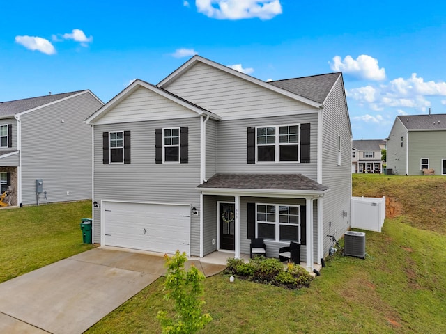 559 Cliff St, Morristown, TN 37814 - traditional-style house featuring an attached garage, concrete driveway, a front lawn, and a shingled roof