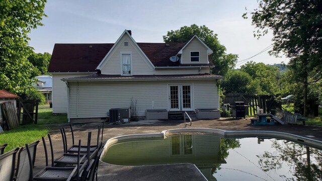 214 E Rhea Ave, Spring City, TN 37381 - rear view of house featuring french doors and a patio