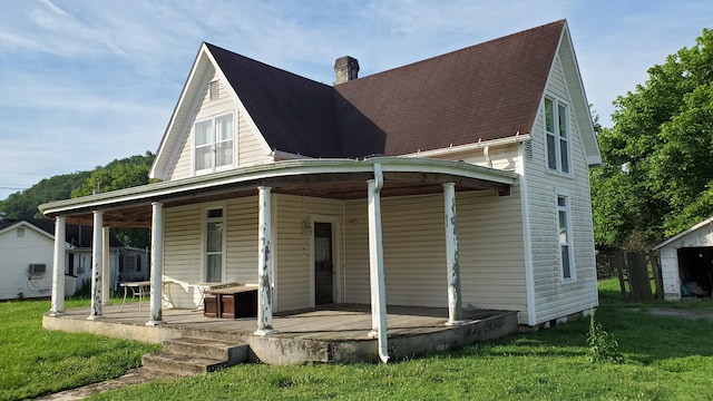 214 E Rhea Ave, Spring City, TN 37381 - rear view of house featuring roof with shingles, a lawn, and a chimney