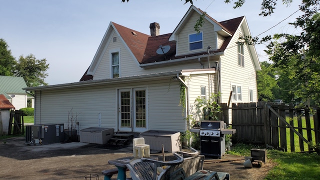 214 E Rhea Ave, Spring City, TN 37381 - back of property with a patio area, a chimney, and entry steps