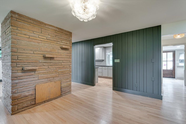 395 Robinson Ln, Decatur, TN 37322 - empty room featuring light wood-type flooring and a chandelier