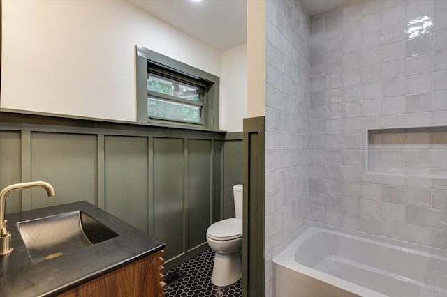 395 Robinson Ln, Decatur, TN 37322 - full bathroom with a decorative wall, vanity, wainscoting, tile patterned floors, and shower / tub combination