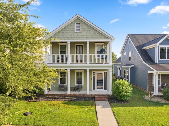 8833 Wilson Creek Dr, Ooltewah, TN 37363 - view of front of house featuring covered porch, a front lawn, and a balcony