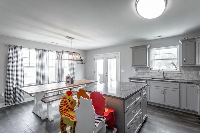 9600 Lovell Rd, Soddy Daisy, TN 37379 - kitchen with gray cabinets, tasteful backsplash, plenty of natural light, and dark wood finished floors