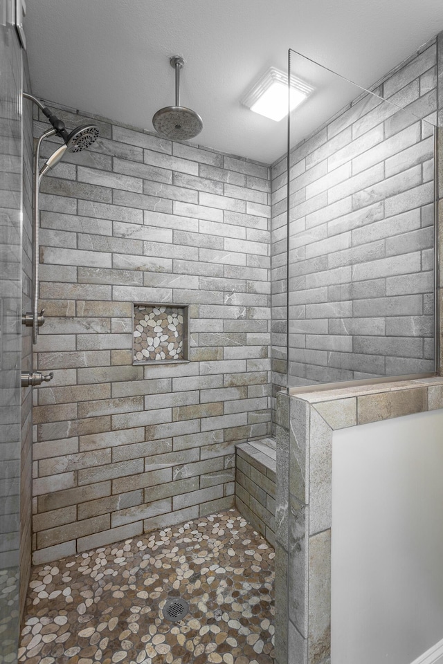 9600 Lovell Rd, Soddy Daisy, TN 37379 - full bath featuring a tile shower and stone finish floors