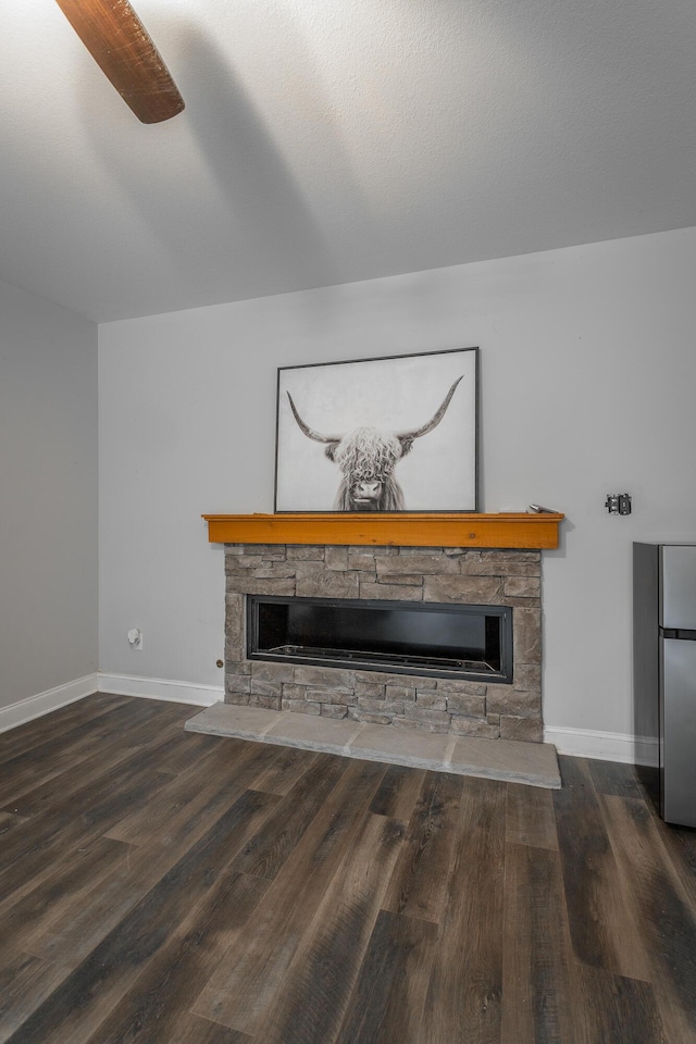 9600 Lovell Rd, Soddy Daisy, TN 37379 - unfurnished living room featuring a stone fireplace and wood finished floors