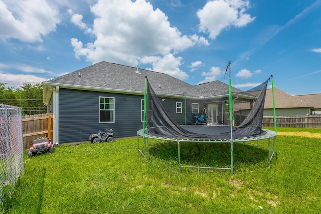 9600 Lovell Rd, Soddy Daisy, TN 37379 - rear view of house featuring a trampoline and a shingled roof