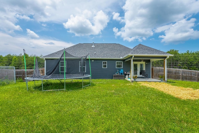 9600 Lovell Rd, Soddy Daisy, TN 37379 - rear view of house featuring a trampoline, french doors, a patio, a fenced backyard, and a shingled roof
