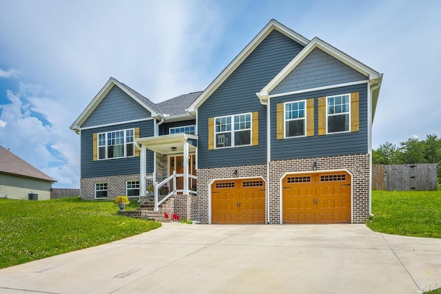 9600 Lovell Rd, Soddy Daisy, TN 37379 - bi-level home featuring a garage, driveway, and brick siding