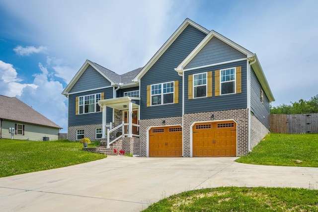 9600 Lovell Rd, Soddy Daisy, TN 37379 - raised ranch with driveway, an attached garage, and brick siding