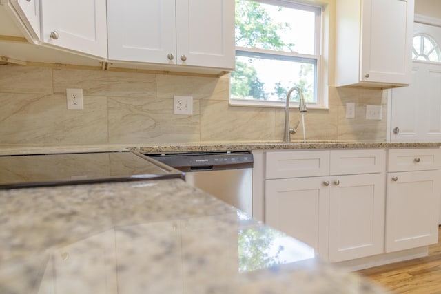 6102 Vance Rd, Chattanooga, TN 37421 - kitchen with stainless steel dishwasher, white cabinets, backsplash, and light stone countertops