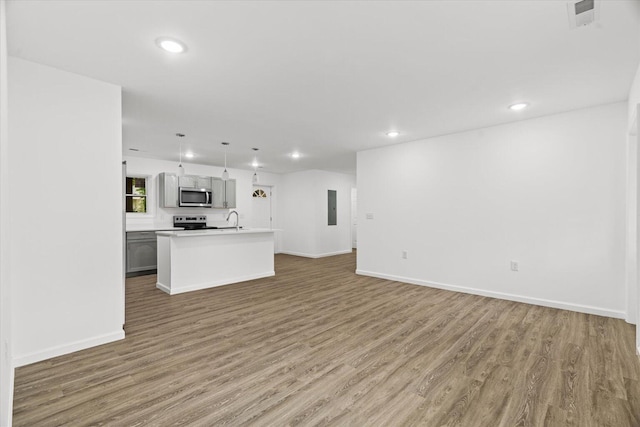 54 Austin Cir, Rossville, GA 30741 - unfurnished living room featuring recessed lighting, light wood finished floors, and electric panel