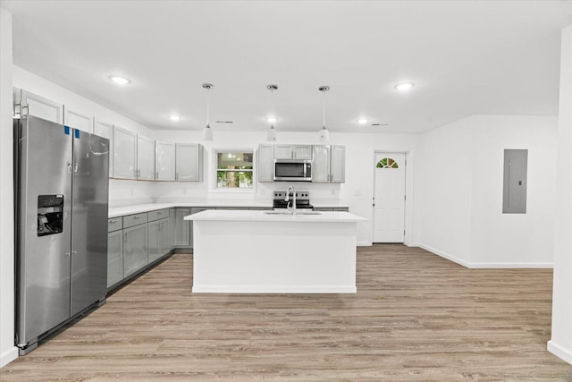 54 Austin Cir, Rossville, GA 30741 - kitchen featuring stainless steel appliances, light wood-type flooring, electric panel, light countertops, and decorative light fixtures