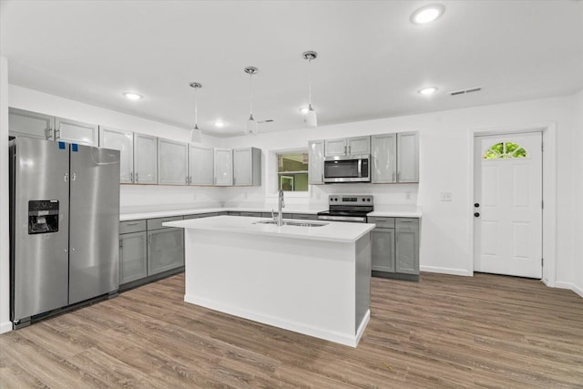 54 Austin Cir, Rossville, GA 30741 - kitchen featuring appliances with stainless steel finishes, gray cabinetry, wood finished floors, recessed lighting, and light countertops